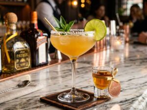 Luxurious Cadillac Margarita cocktail in an elegant glass with a salted rim and fresh lime wheel